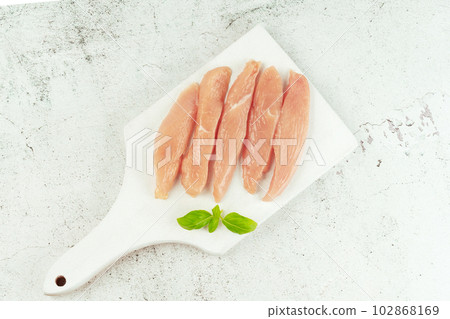 Raw chicken meat.Raw fresh Chicken breast Fillets.Food for retail.Procurement for designers.Ogranic food,healthy eating.Food concept.Top view.Chicken breast Fillets.Close up. 102868169