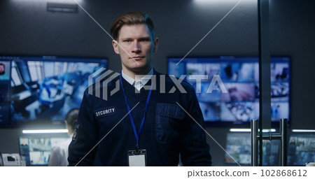 Male security officer in police monitoring center Male security officer in police monitoring center 102868612