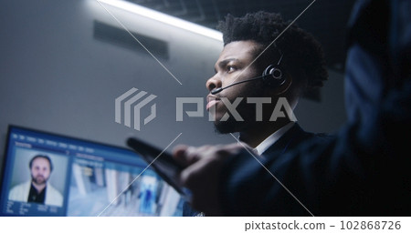 African American male officer talks with colleague African American male officer talks with colleague 102868726