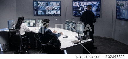 Officers monitor cameras with AI face scanning 102868821