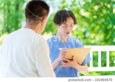 Senior man being examined by a doctor 102869670