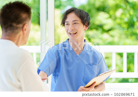 Senior man being examined by a doctor 102869671