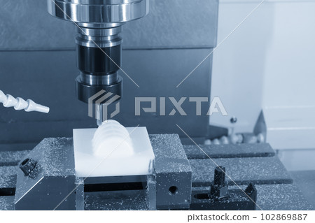 The CNC milling machine cutting the nylon 6 material part with ball end mill tool. The CNC milling machine cutting the nylon 6 material part with ball end mill tool. 102869887