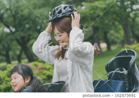 mom wearing a bicycle helmet mom wearing a bicycle helmet 102873691