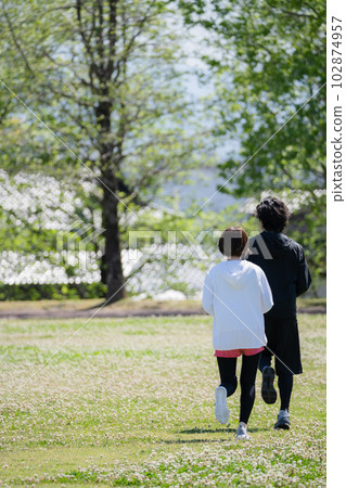 Young couple running in the park Young couple running in the park 102874957