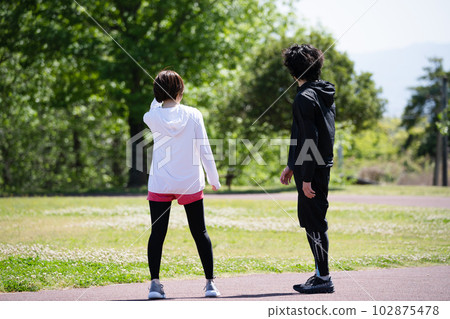 Young couple running in the park Young couple running in the park 102875478