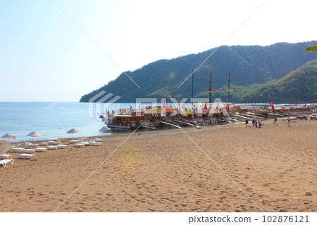 Yacht on the shore of the cozy bay of Adrasan, near Antalya and Kemer, Turkey Yacht on the shore of the cozy bay of Adrasan, near Antalya and Kemer, Turkey 102876121