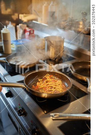 Chef is stirring vegetables in wok on street food concept. Chef is stirring vegetables in wok on street food concept. 102876443