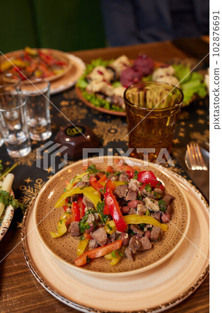 View from above of georgian cuisine on brown wooden table.Traditional georgian food. 102876691