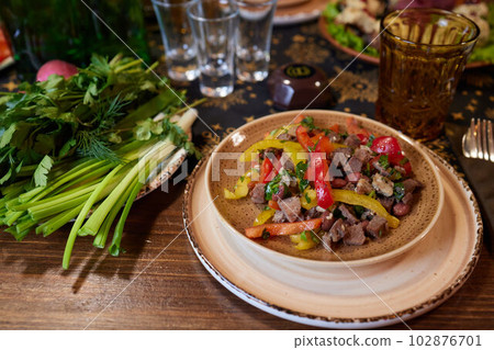View from above of georgian cuisine on brown wooden table.Traditional georgian food. View from above of georgian cuisine on brown wooden table.Traditional georgian food. 102876701