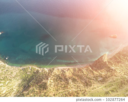 Aerial view. The drone flies over foggy and fluffy clouds. Blue sky sun and sea fog. Abstract aerial nature summer ocean sunset sea and sky background. Horizon. Vacation, travel and holiday concept Aerial view. The drone flies over foggy and fluffy clouds. Blue sky sun and sea fog. Abstract aerial nature summer ocean sunset sea and sky background. Horizon. Vacation, travel and holiday concept 102877264
