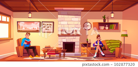 Couple reading in home living room with fireplace 102877320