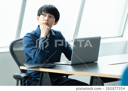 IT engineer working in the office IT engineer working in the office 102877354