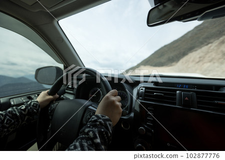 Driving car on high altitude mountain trail, China Driving car on high altitude mountain trail, China 102877776