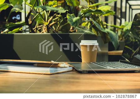 Mock up of modern laptop at table in co-working space. Remote Freelancer's place of work. Study and work online. Remote business education. Concept of webinar. E-learning Workstation Take away Mock up of modern laptop at table in co-working space. Remote Freelancer's place of work. Study and work online. Remote business education. Concept of webinar. E-learning Workstation Take away 102878867
