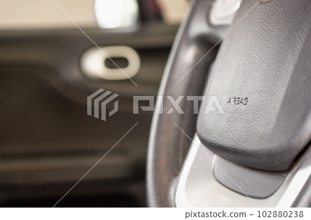 Safety airbag sign on car steering wheel Safety airbag sign on car steering wheel 102880238