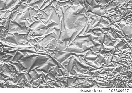 Shiny metal silver gray foil crumpled texture background Shiny metal silver gray foil crumpled texture background 102880617