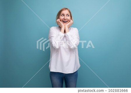 happy blond middle aged woman in white blouse happy blond middle aged woman in white blouse 102881666