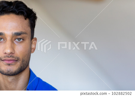 Portrait of biracial man looking at camera with copy space 102882502
