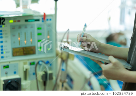 The specialist aThe specialist are checking continuous renal replacement therapy equipment and inre checking continuous renal replacement therapy equipment and injection pump and hemodialysis machine. The specialist aThe specialist are checking continuous renal replacement therapy equipment and inre checking continuous renal replacement therapy equipment and injection pump and hemodialysis machine. 102884789