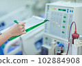 The specialist are checking continuous renal replacement therapy equipment and injection pump and hemodialysis machine. 102884908