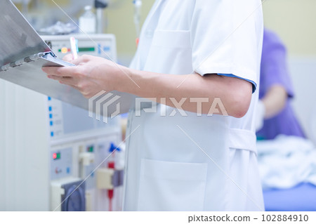 The specialist are checking continuous renal replacement therapy equipment and injection pump and hemodialysis machine. The specialist are checking continuous renal replacement therapy equipment and injection pump and hemodialysis machine. 102884910