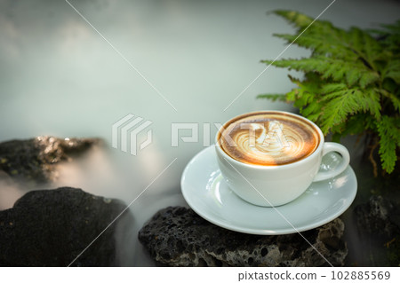 Background Coffee cup and beans on old kitchen table.  102885569