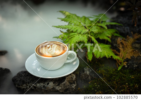 Background Coffee cup and beans on old kitchen table.  102885570