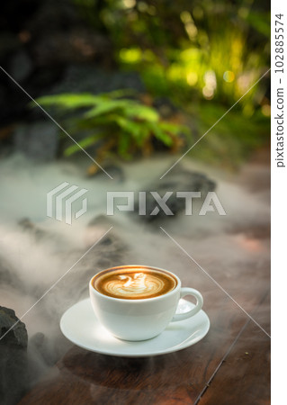 Background Coffee cup and beans on old kitchen table.  102885574