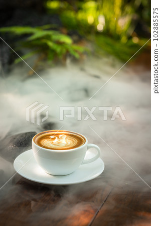 Background Coffee cup and beans on old kitchen table.  102885575