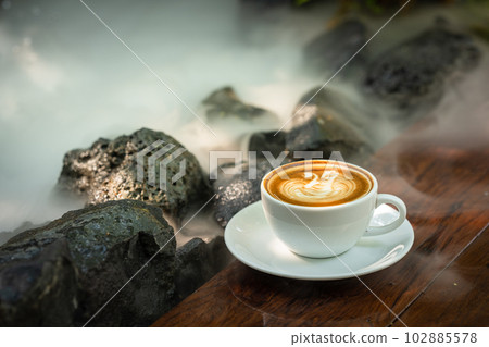 Background Coffee cup and beans on old kitchen table.  102885578