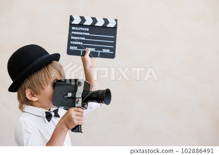 Child pretend to be a director Child pretend to be a director 102886491