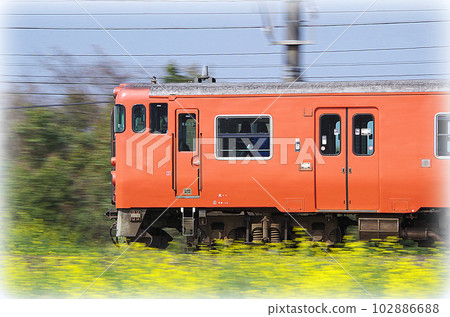 A vermilion diesel train bound for Izumo City running on the Sanin Main Line in the early afternoon (illustration style) A vermilion diesel train bound for Izumo City running on the Sanin Main Line in the early afternoon (illustration style) 102886688