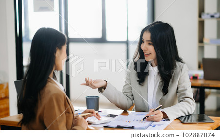 Portrait of success business people working together in home office. Couple teamwork startup concept.. 102887074