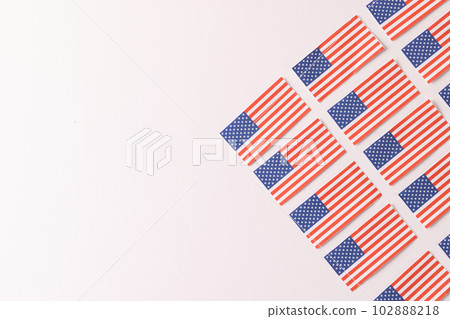 High angle view of rows of flags of united states of america with copy space on white background 102888218