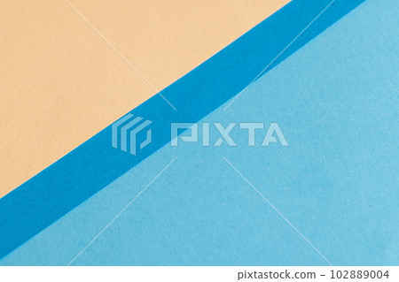 Close up of pieces of beige and blue paper with copy space Close up of pieces of beige and blue paper with copy space 102889004