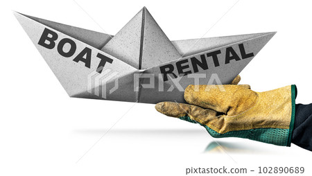 Hand Holding a White Paper Boat with Text Boat Rental 102890689