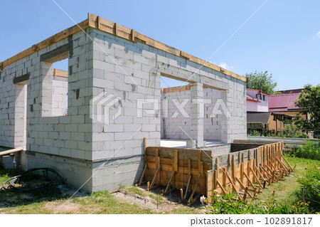 Part of a house under construction from a gas block. Construction concept 102891817