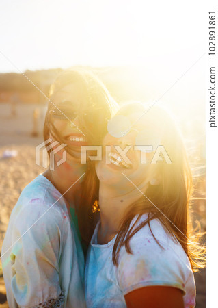 Two beautiful girls have a great time on Holi festival. Spring Break Beach Party. Friendship, Leisure, Vacation Two beautiful girls have a great time on Holi festival. Spring Break Beach Party. Friendship, Leisure, Vacation 102891861