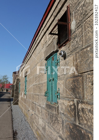This is a picture of the beautiful blue sky and the Nikka Whiskey Yoichi Distillery. 102892417