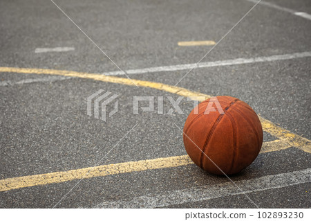 Basketball ball on the asphalt sports ground. Sports concept 102893230