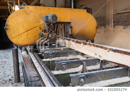 Processing wooden boards at a sawmill. 102893274