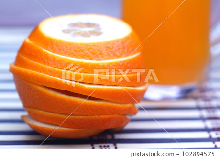 Orange juice with sliced orange Orange juice with sliced orange 102894575