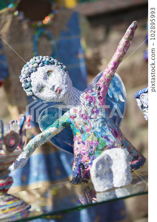 Angel made of scraps of paper. Garbage recycling 102895993