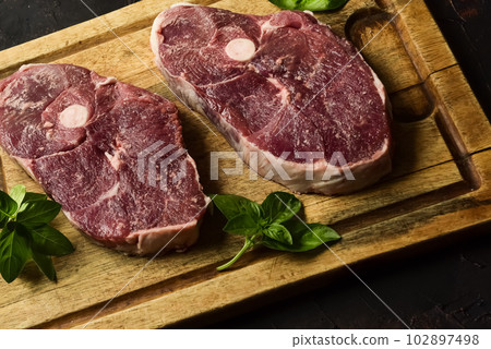 Patagonian lamb meat presented on the wooden table, Patagonia Argentina. 102897498
