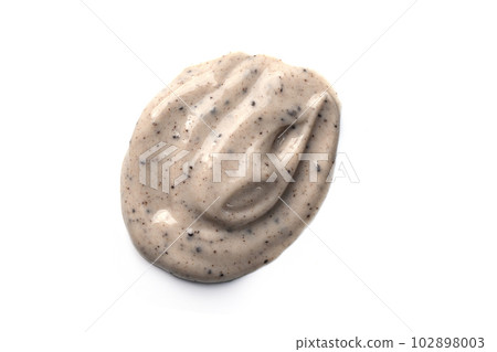 Face cream coffee scrub swatch isolated on white background. Cosmetic exfoliation product. Handmade coffee scrub for body care. 102898003