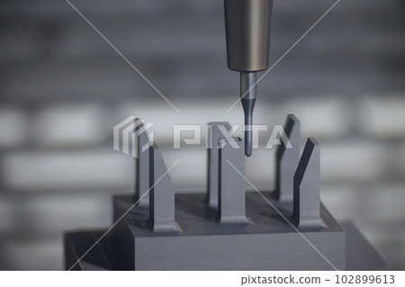 The CNC milling machine finish cutting the graphite electrode parts with solid ball end mill. The CNC milling machine finish cutting the graphite electrode parts with solid ball end mill. 102899613