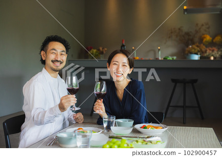 A couple dining at a restaurant A couple dining at a restaurant 102900457