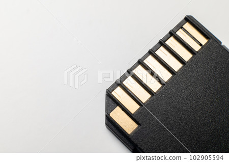 The contact group of the SD flash memory card is black on a gray background. macro close-up 102905594