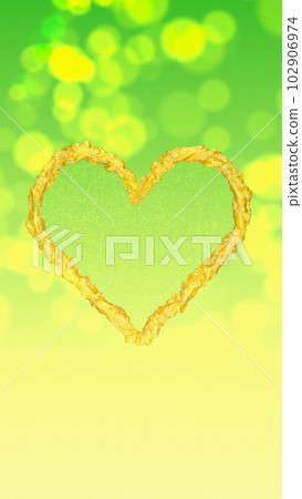 Golden Heart on a Green-Yellow Bokeh Background 102906974